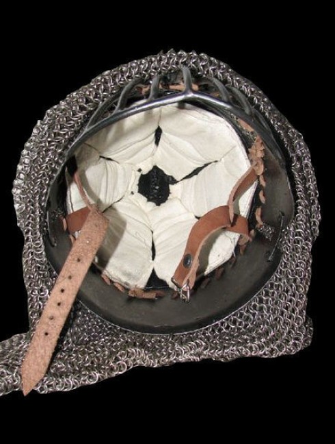 Conical spangen helmet of the XII century with bar grill Corazza