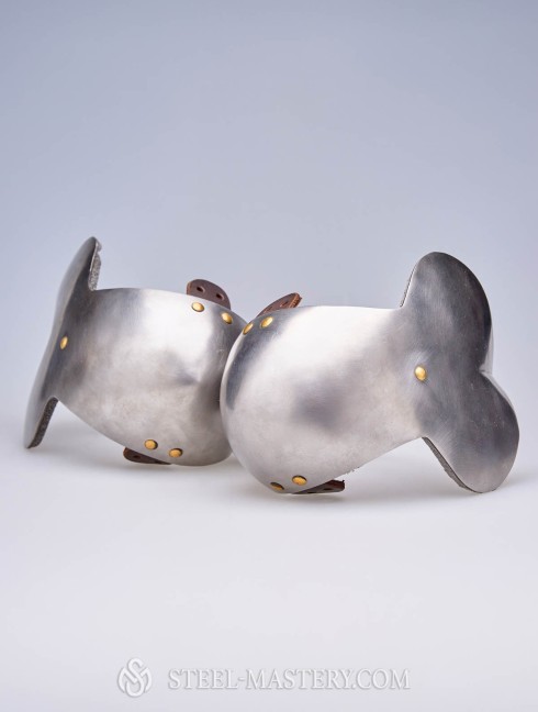 Steel elbow caps with additional shock absorbing layer  Versandfertig