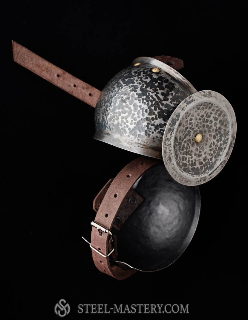 Elbow caps with chased rondel photo made by Steel-mastery.com